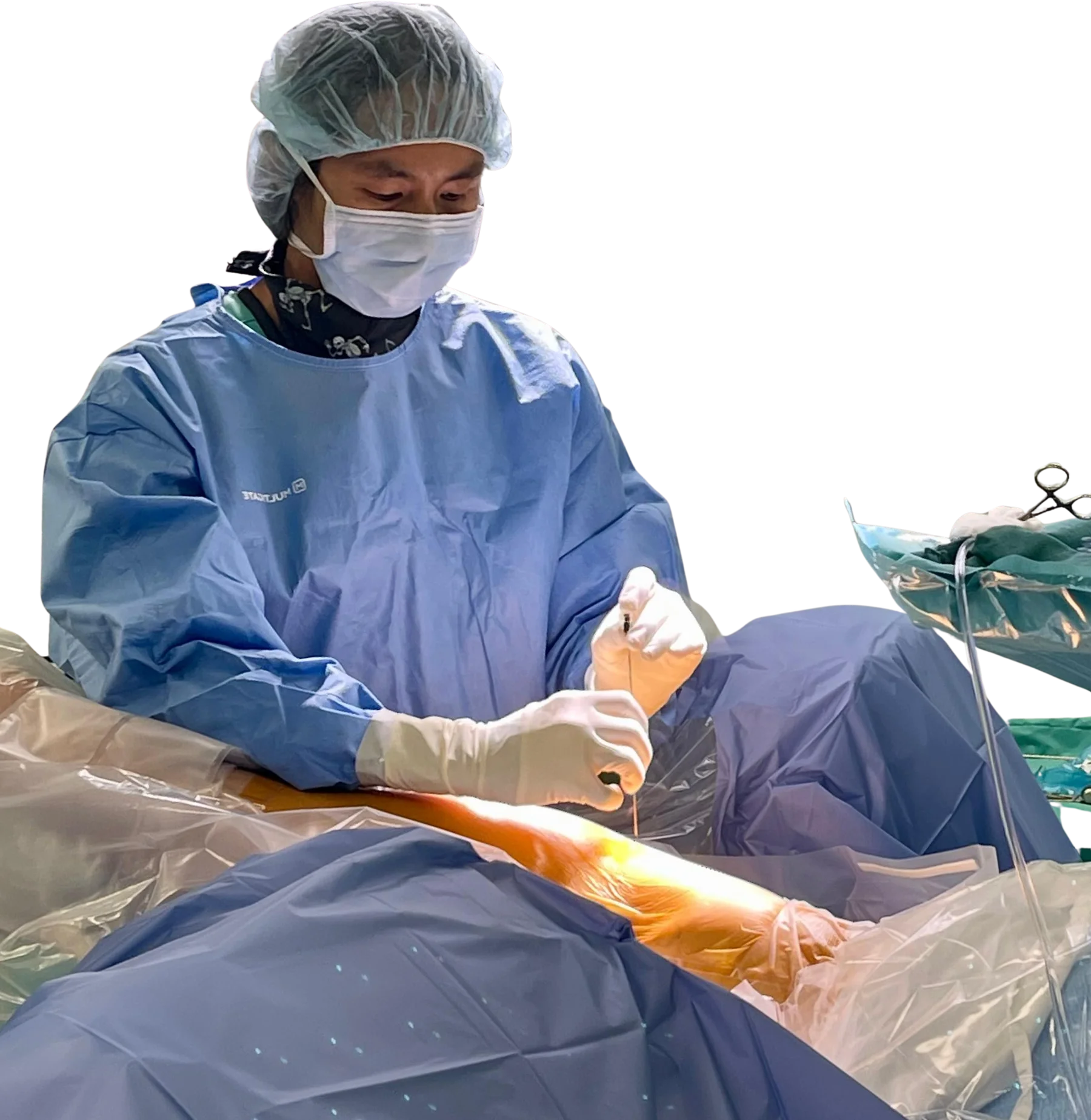 Dr Foo performing surgery on patient.